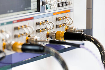 Probes plugged into an oscilloscope